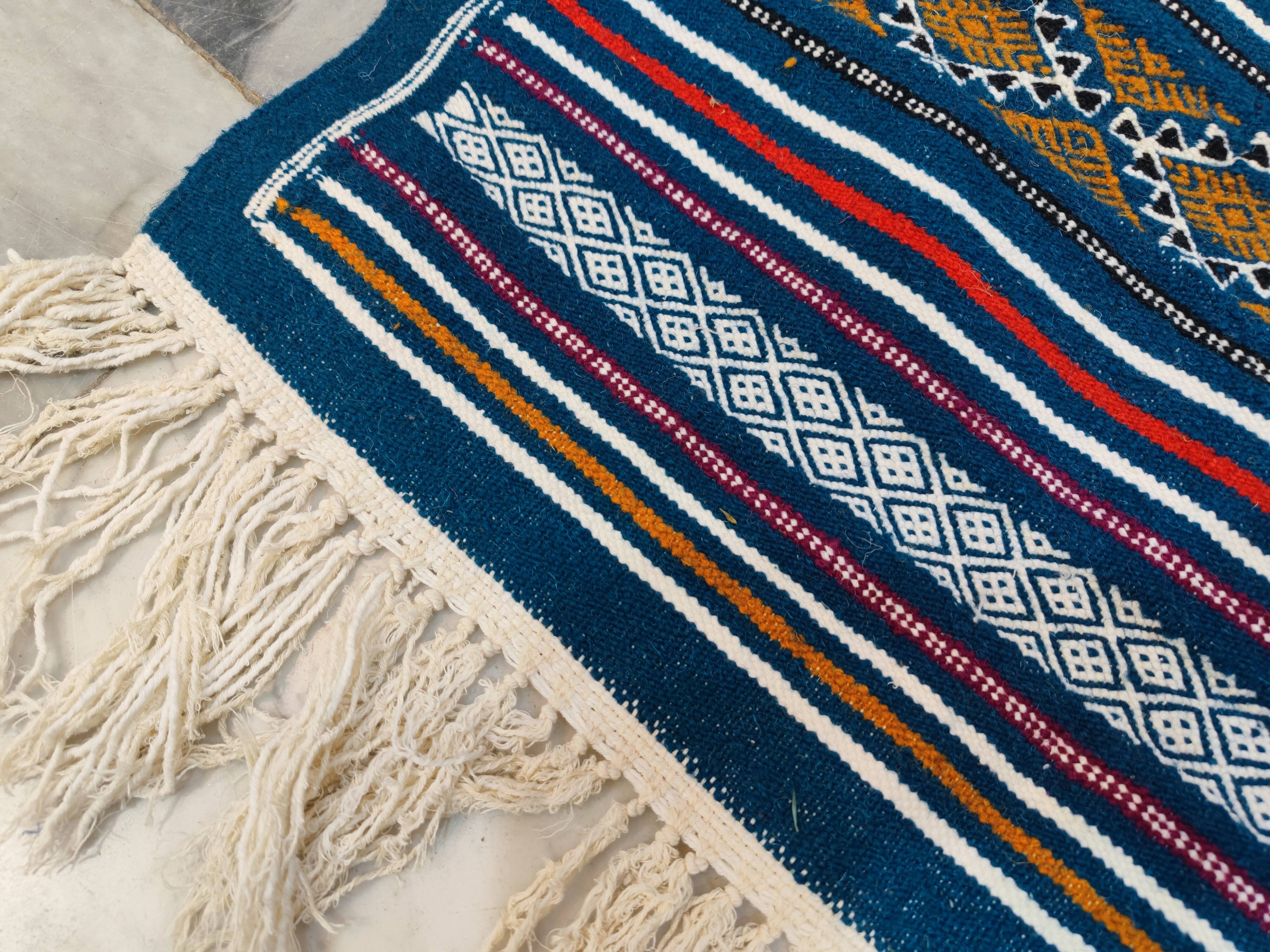 Handwoven blue kilim rug in natural wool