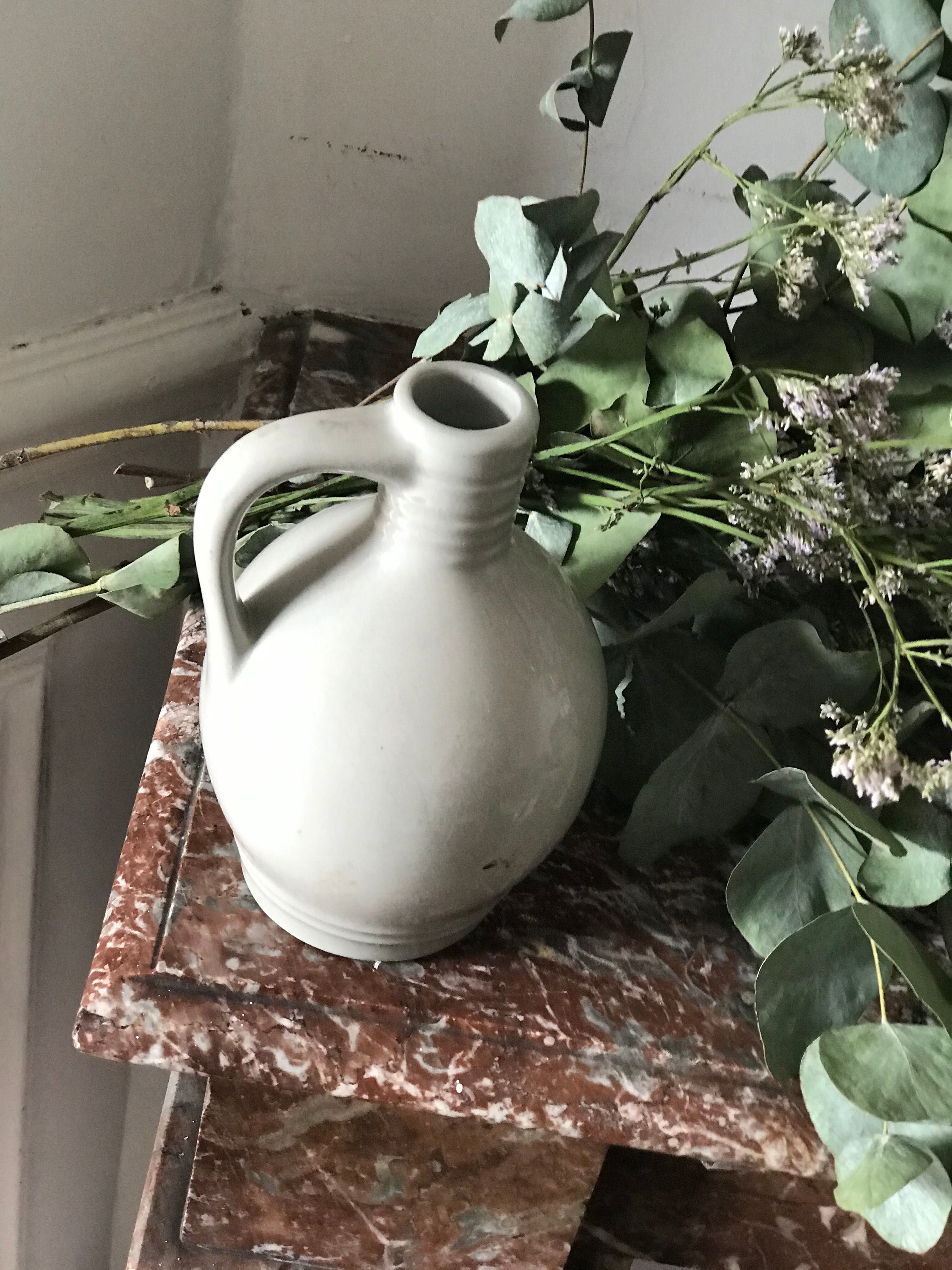 Pitcher with ceramic handle