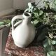 Pitcher with ceramic handle