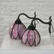 pair of iron wall lights and Tiffany style glass legs