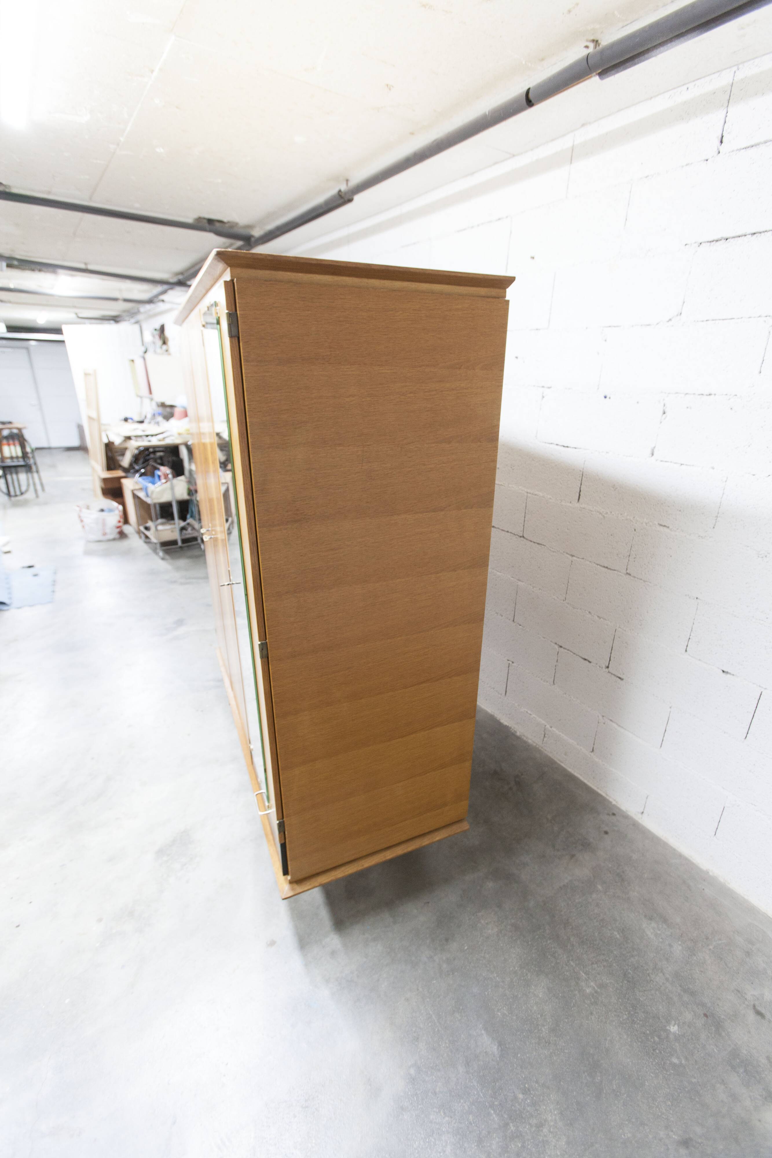 French wardrobe with tapered legs, 3 doors, 1 mirror (27*130), and 1 drawer.