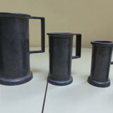 Set of 6 Fleur de Lys pewter measuring pots