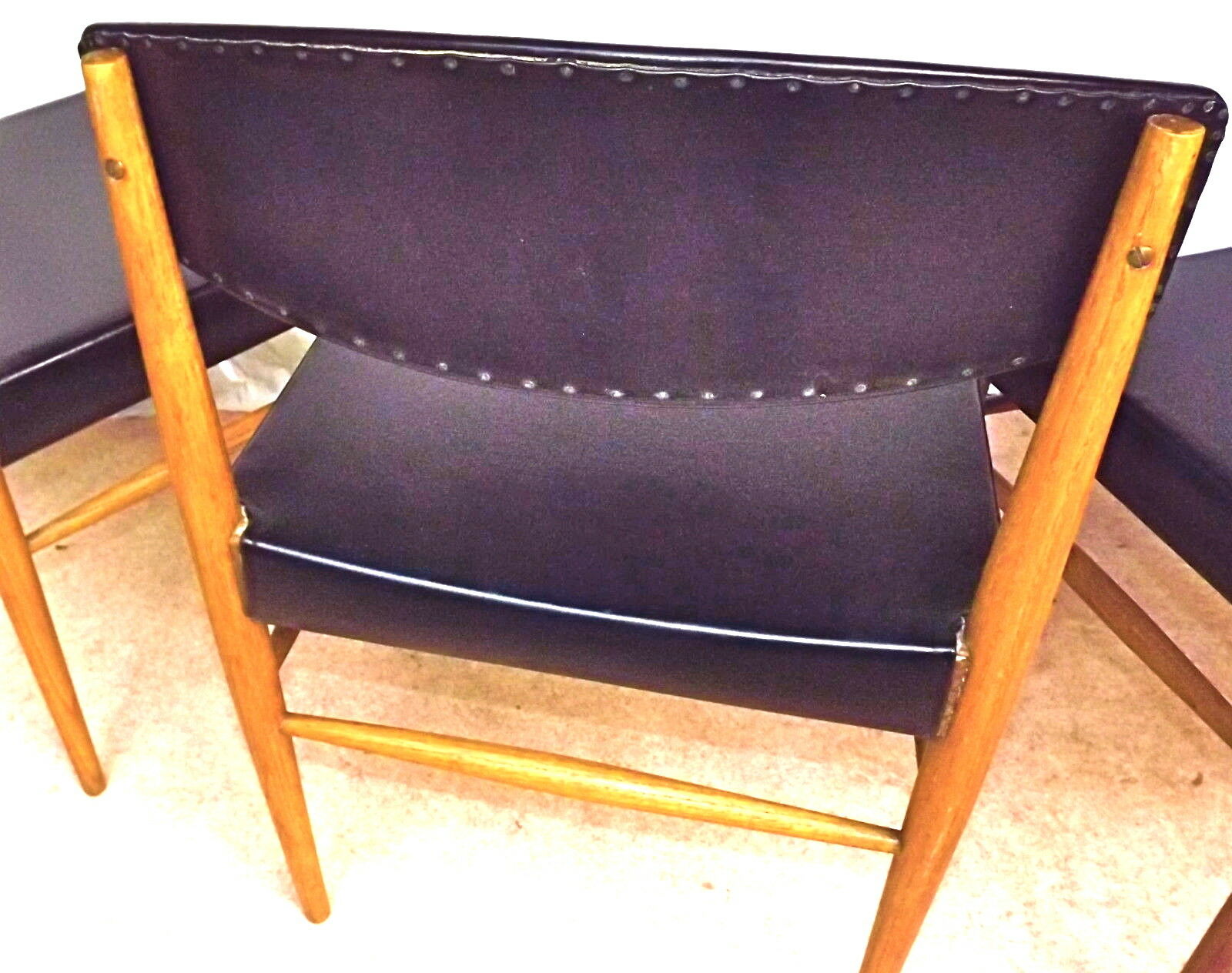 Four Scandinavian-style chairs