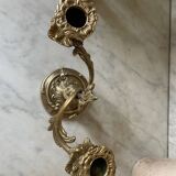 Pair of rocaille candlesticks in gilded bronze