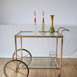 Serving table in gilded metal and glass with large wheels 1950