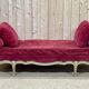 Louis XV style daybed in painted wood and covered with a red velvet