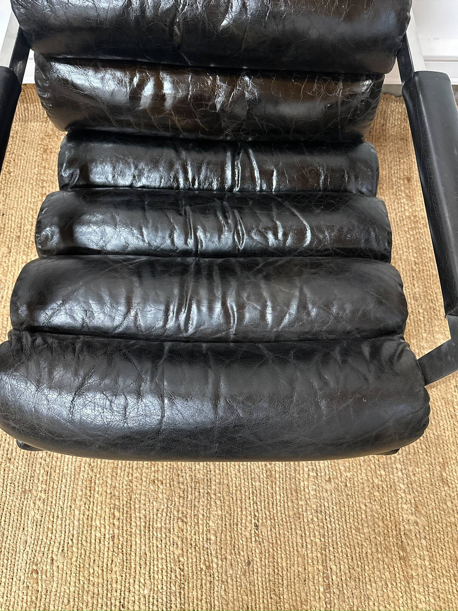 Vintage 1970s black leather armchair – metal frame