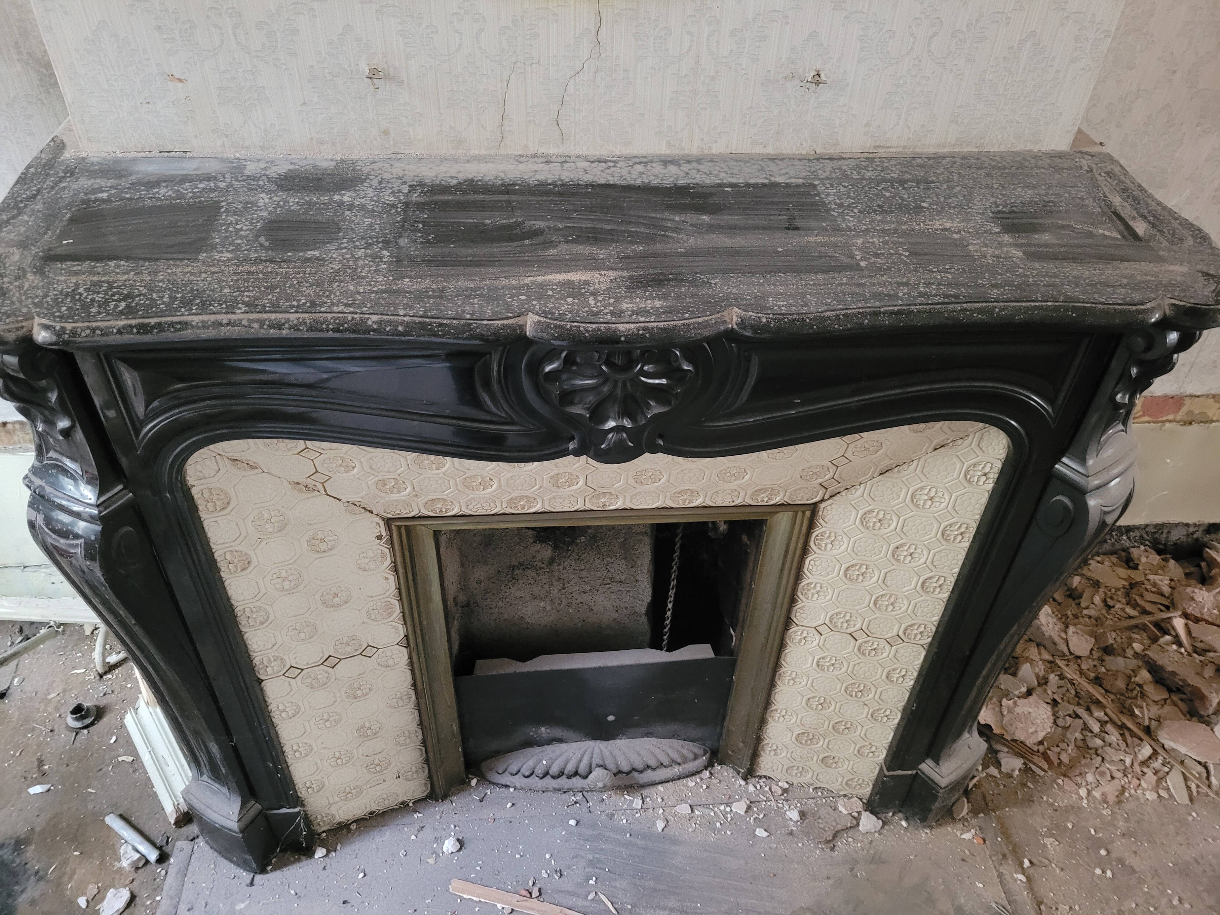 Louis XV style fireplace in black marble