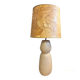 Large beige ceramic table lamp with a vintage shade.