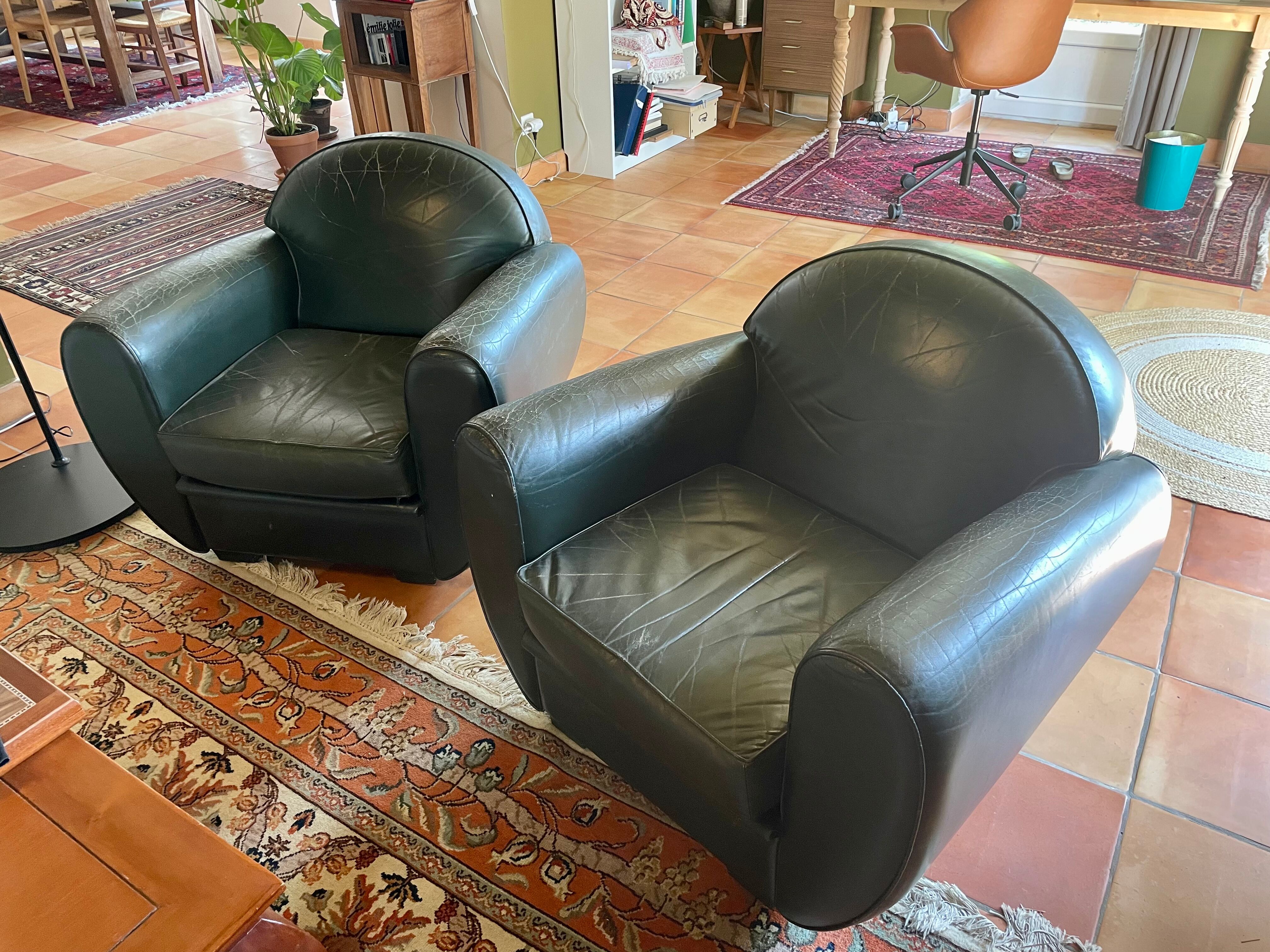 Green leather club chairs