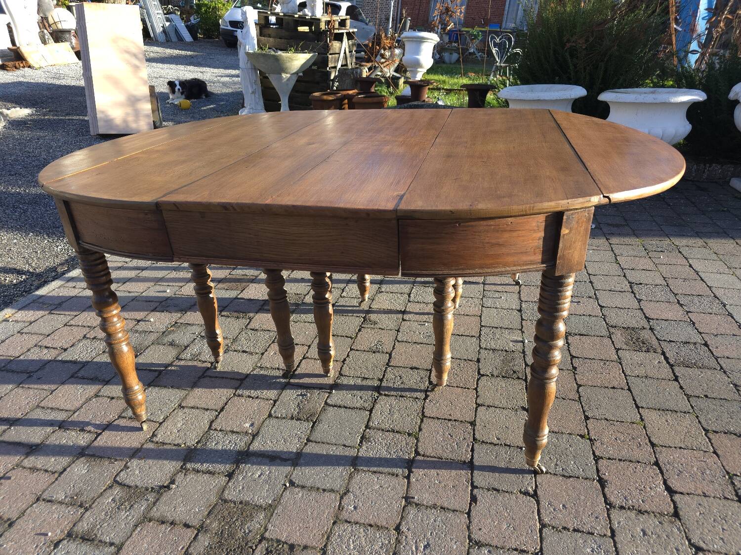12-foot round oak table with 7 extensions / 20 people