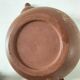 Japanese teapot in red clay engraved with integrated filter.