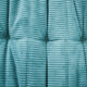 Ensemble de fauteuil et pouf Togo en velours côtelé bleu clair.