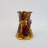 Beautiful ceramic pitcher in fire colors