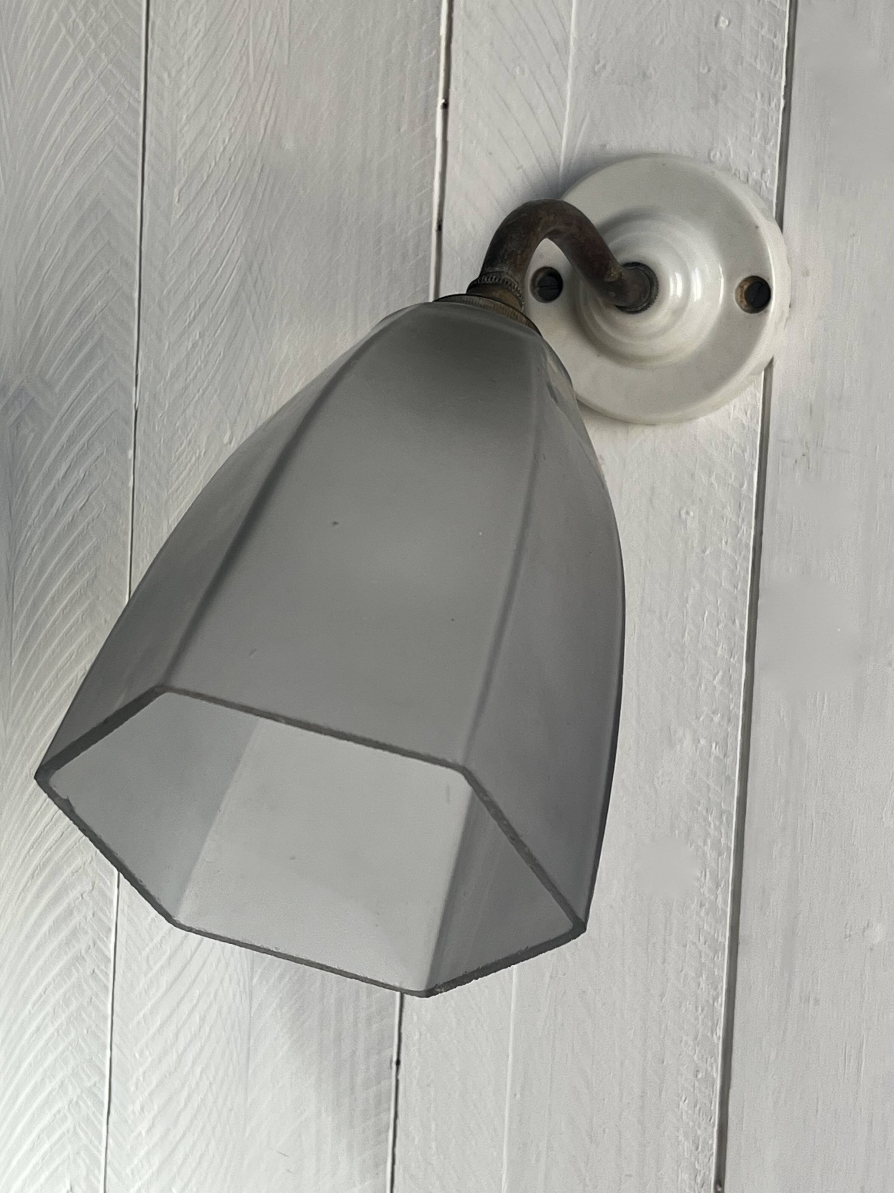Swan neck wall light on porcelain base