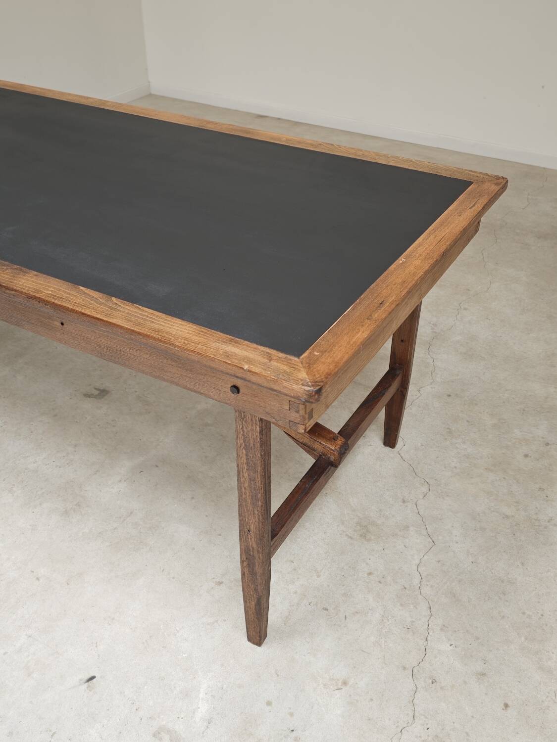 Vintage workshop folding table in oak with a hand-patinated black top.