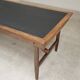 Vintage workshop folding table in oak with a hand-patinated black top.