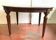 Louis XVI style table in mahogany and light wood 20th century