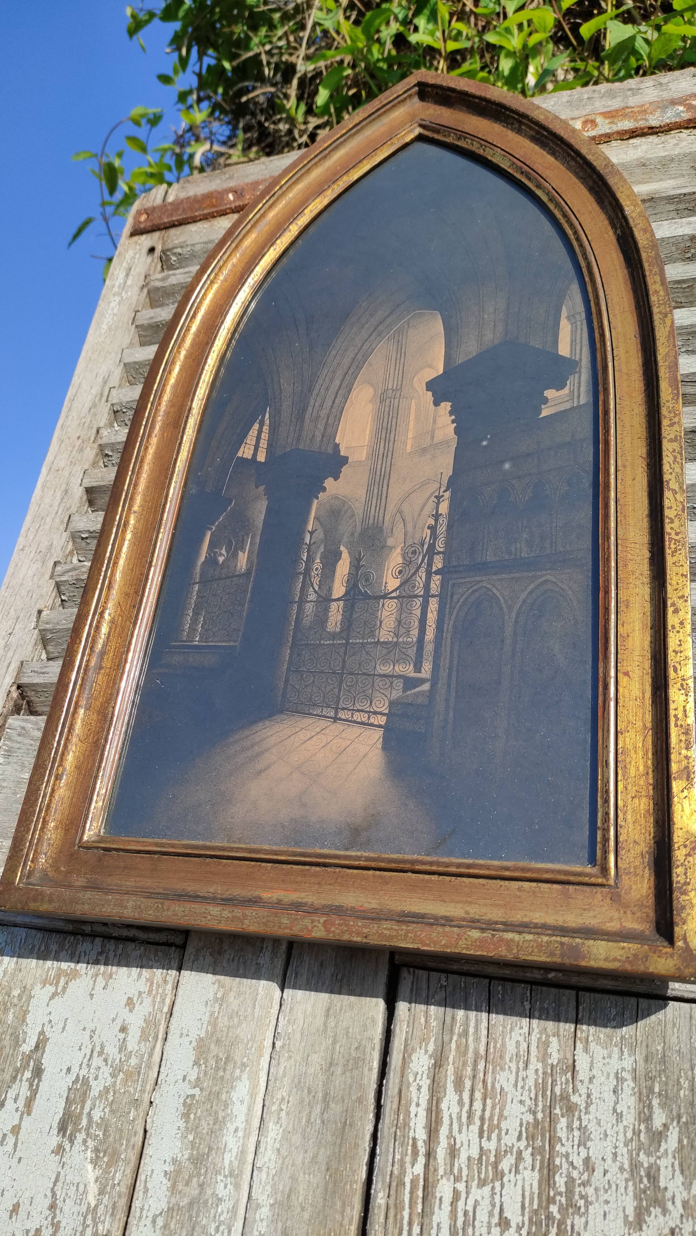 Large old wall frame in gilded wood