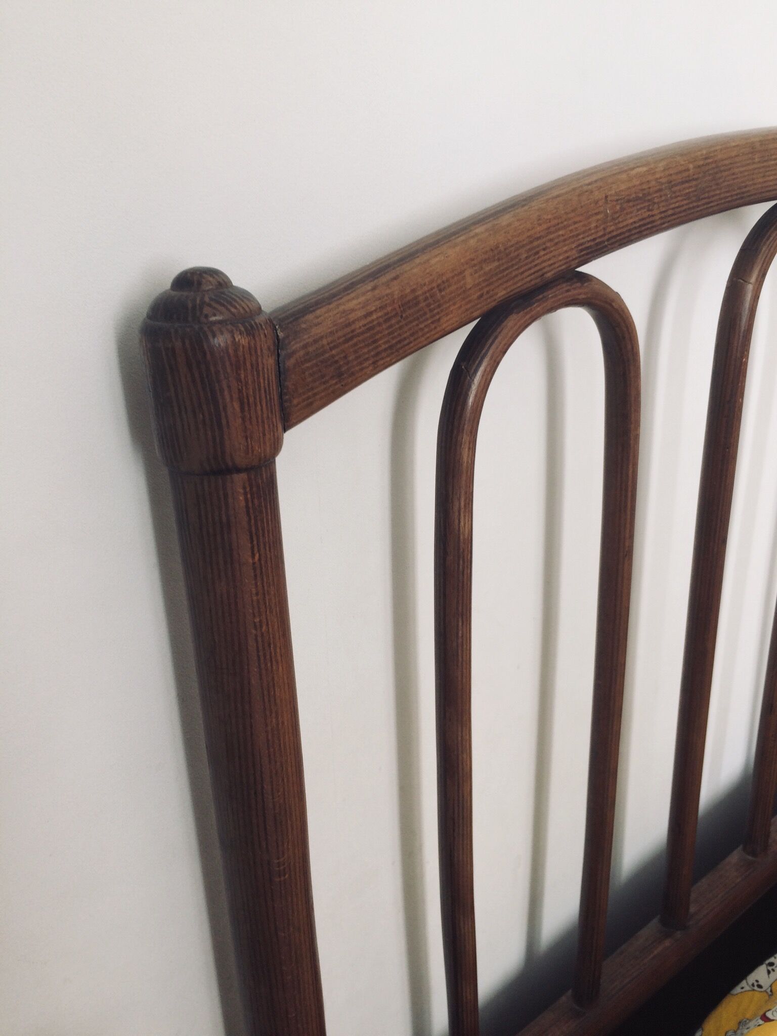 Old curved wooden bed - one person