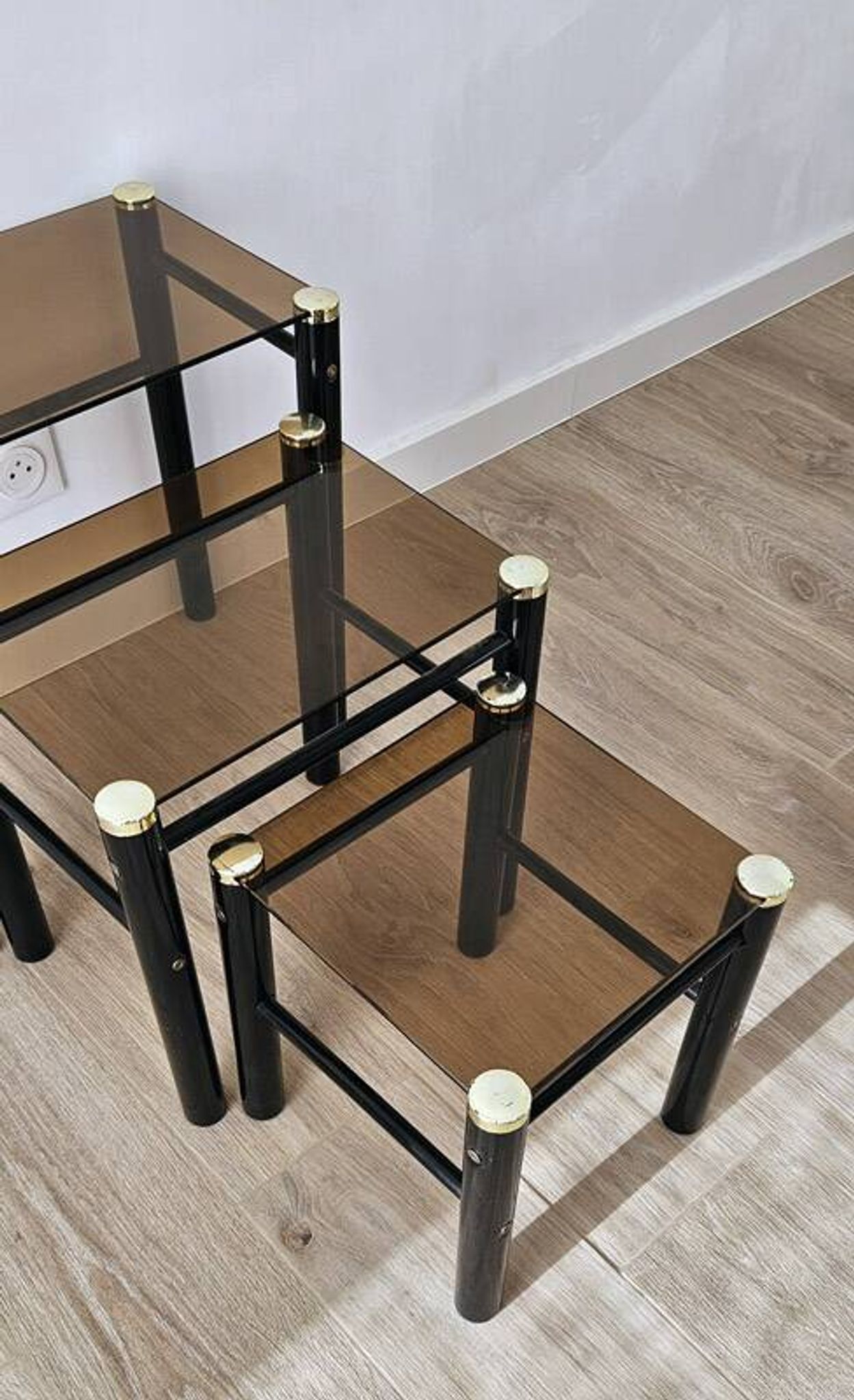 Set of 3 vintage nesting tables in smoked glass and black metal – 1970s