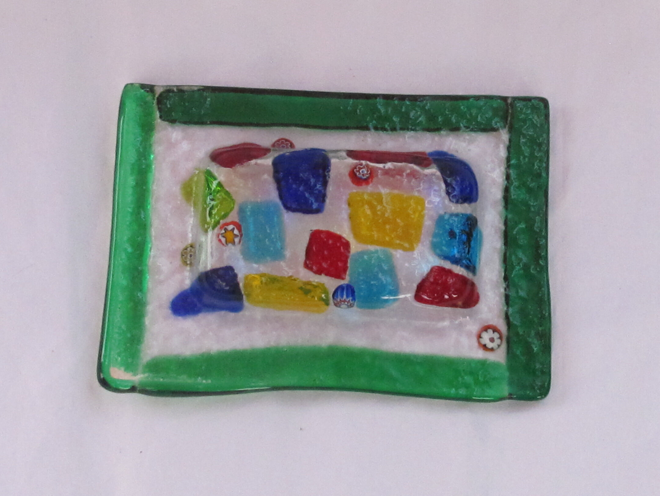 Empty millefiori-style glass pocket