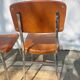 3 chaises vintage en inox et simili-cuir marron