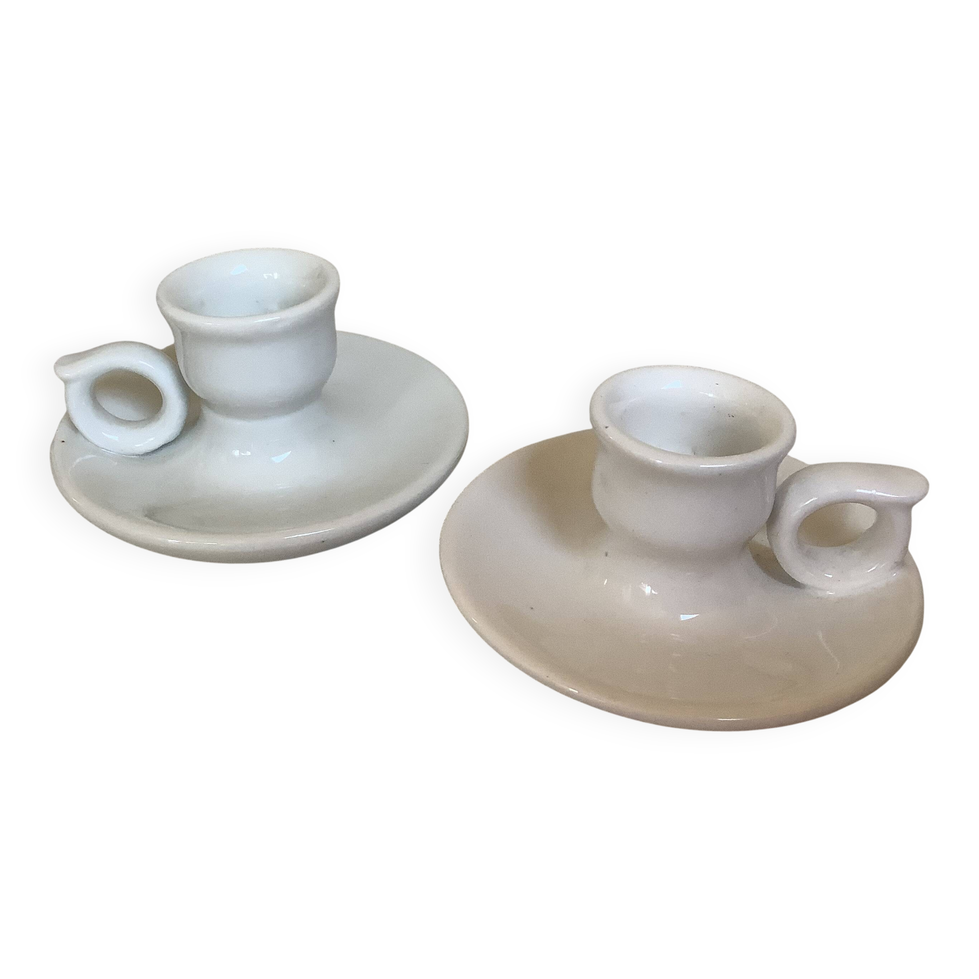 Pair of small white cellar rat candlesticks