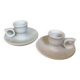 Pair of small white cellar rat candlesticks