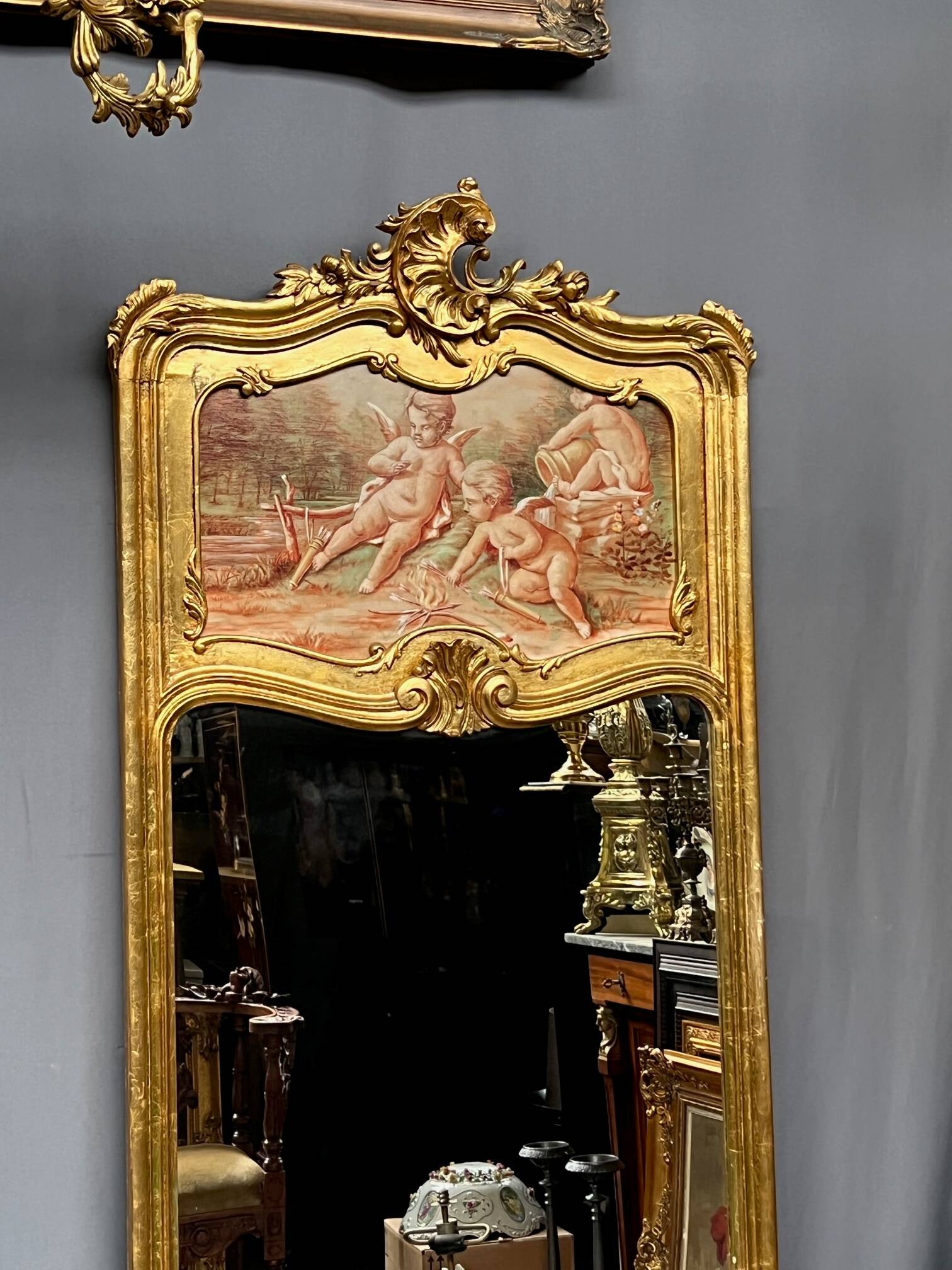 Antique Rococo mirror with cherubs