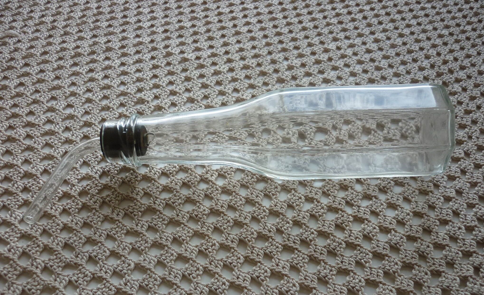 Old bottle with glass pipette