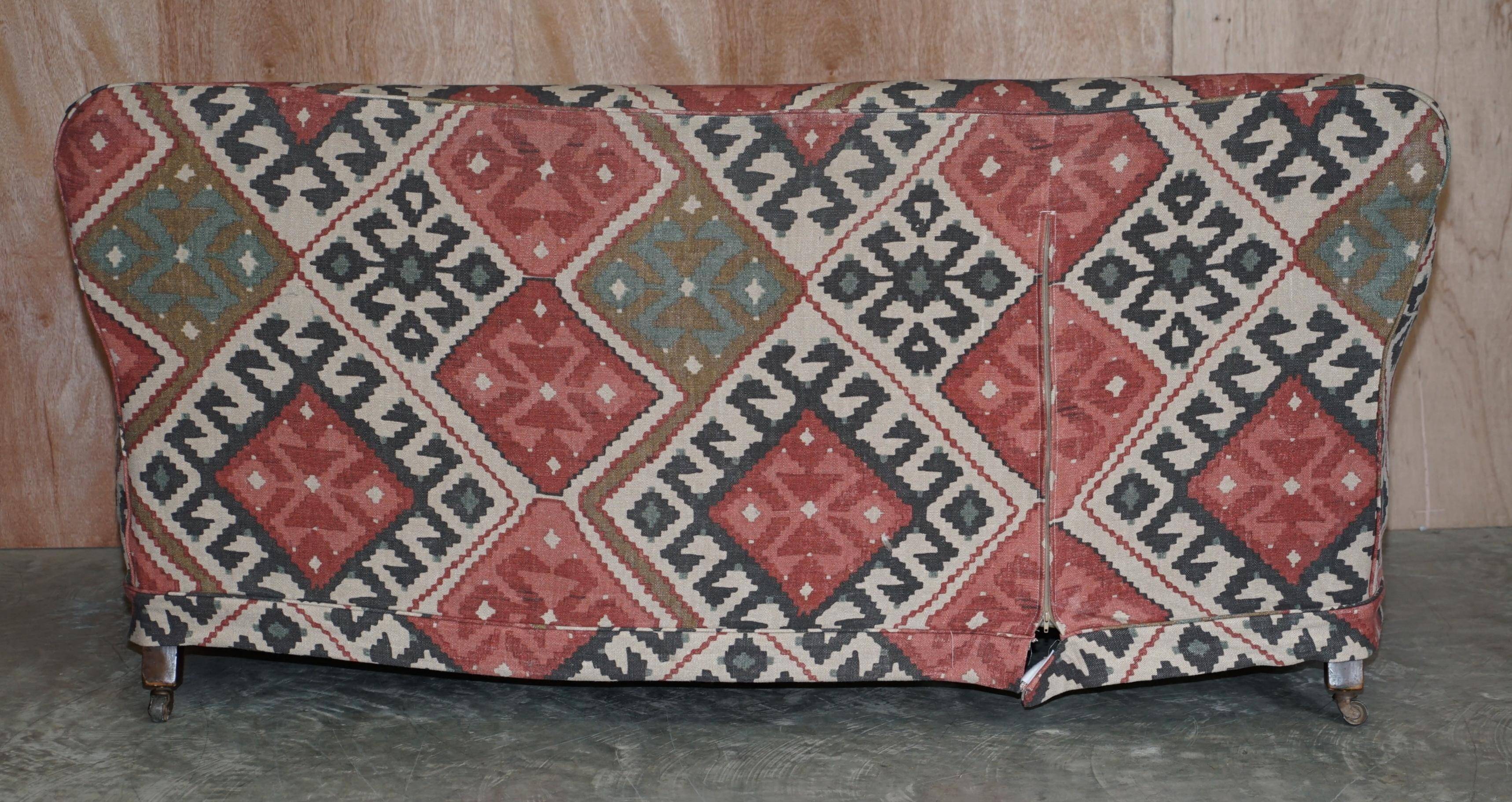 Victorian canapé upholstered in Kilim with turned mahogany legs.