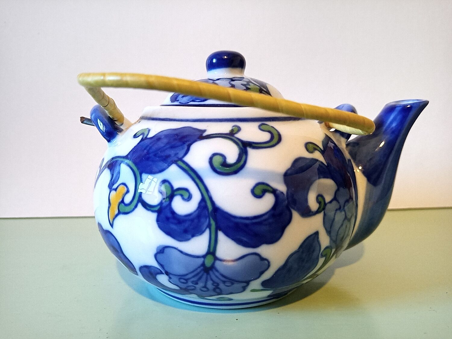 Hand-painted blue floral pattern teapot
