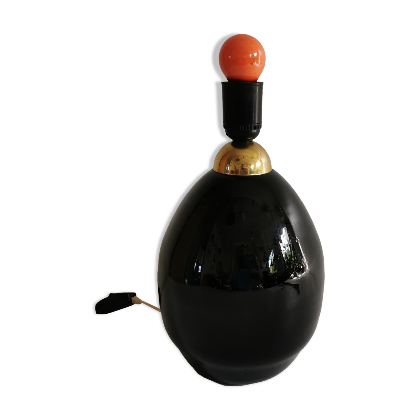 Table lamp, made of handmade coal-black glass, with brass coloured top.