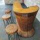 Vintage rattan and metal bar and its stools.