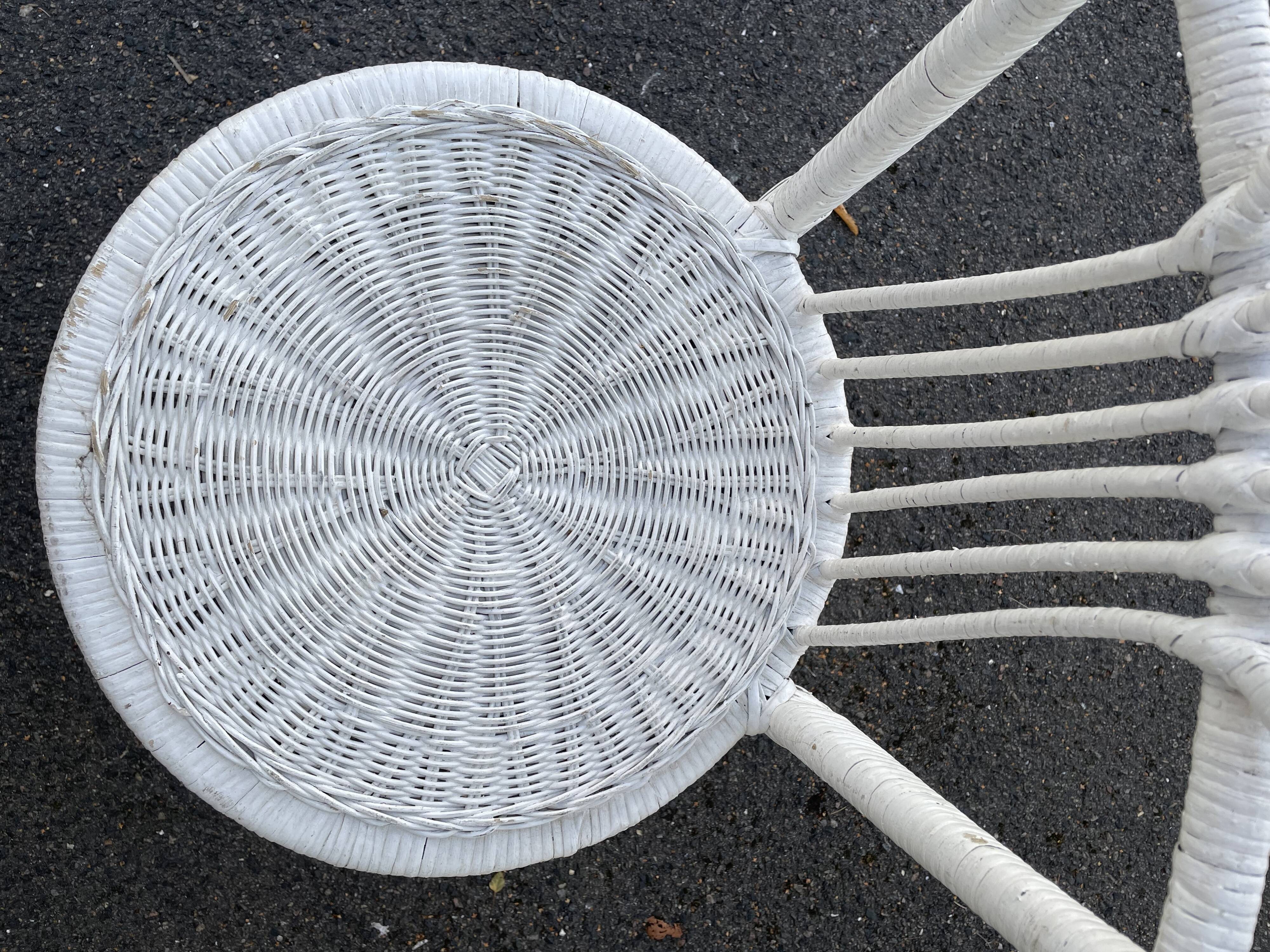 Pair of white peacock rattan chairs, circa 1960