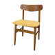 Scandinavian chair with mustard yellow fabric
