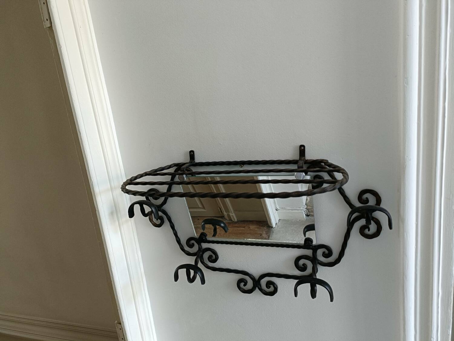 Twisted wrought iron wall-mounted coat rack