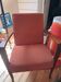 Vintage Art Deco armchair in curved wood and terracotta fabric.