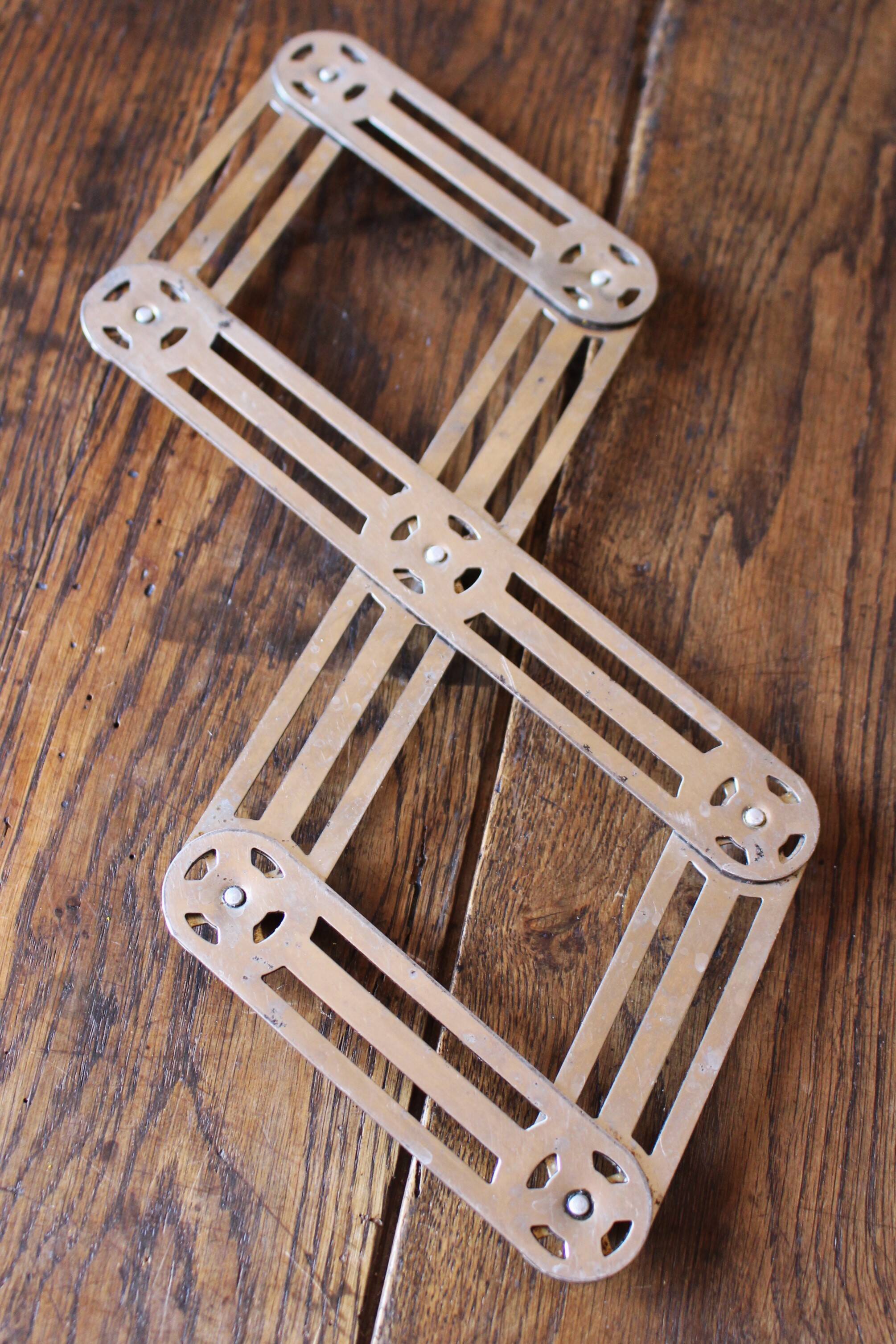 Vintage accordion folding metal trivet