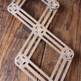 Vintage accordion folding metal trivet