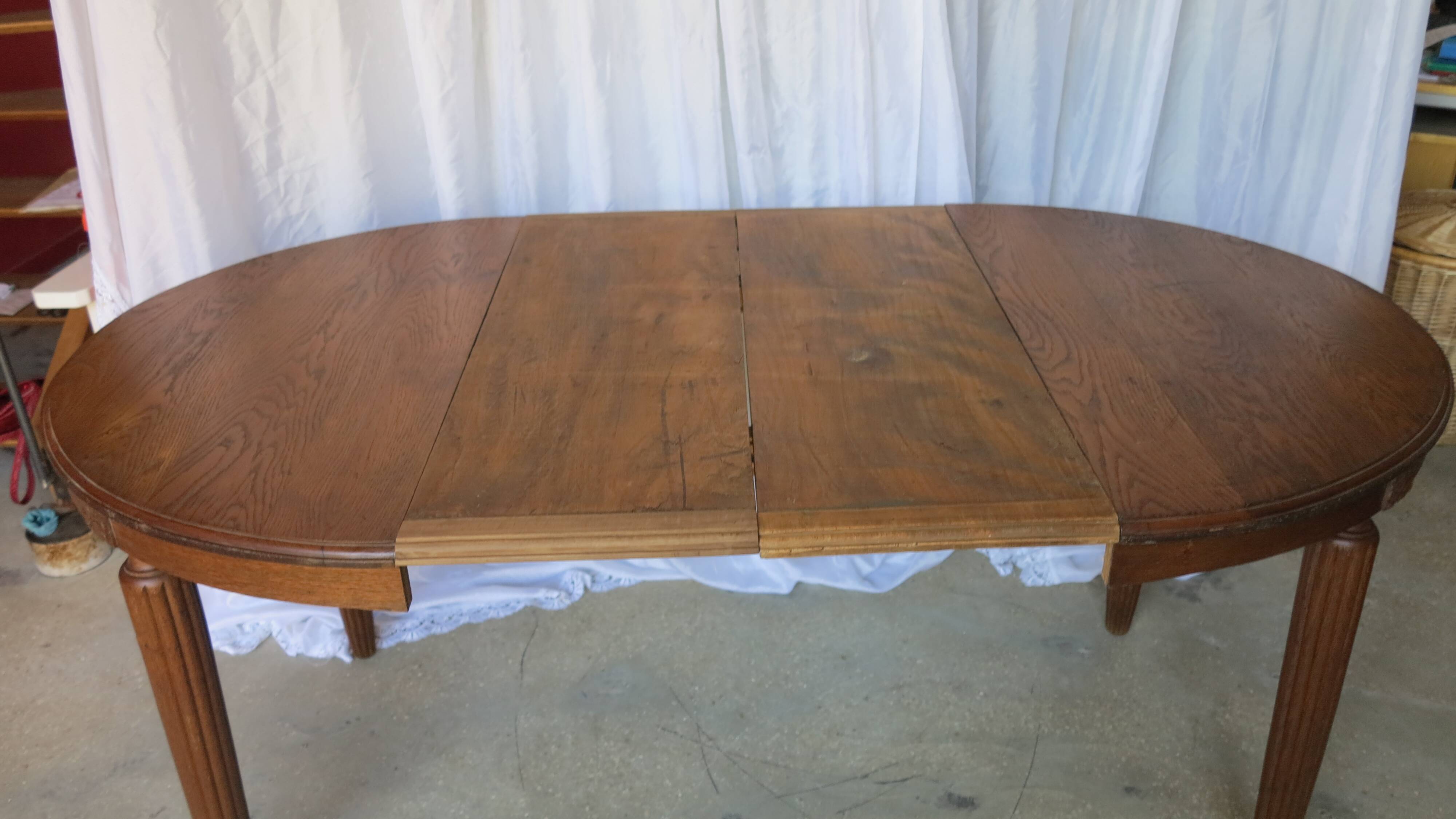1930s oak dining table, slightly oval.
