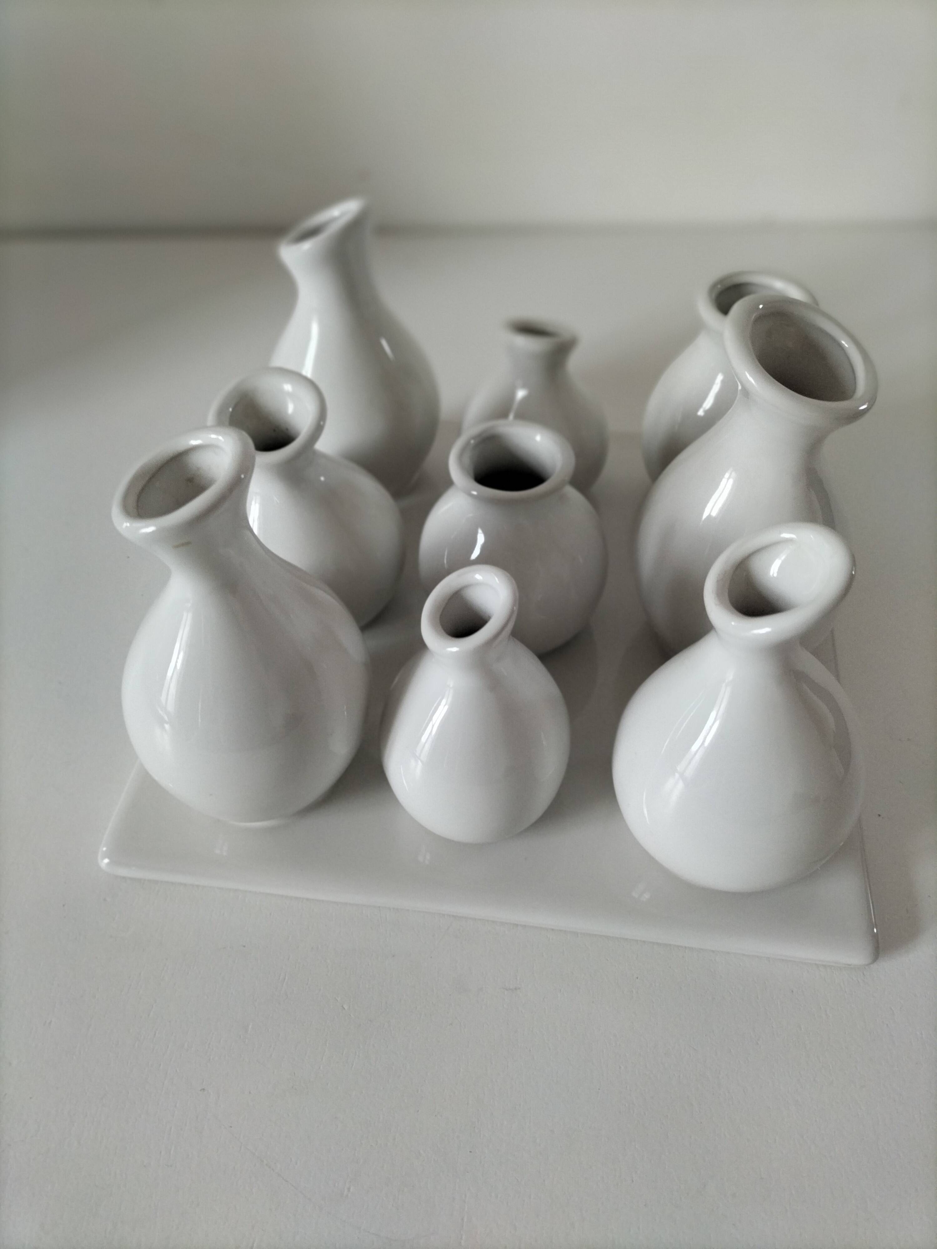 Multiple vintage white soliflore – centrepiece with 9 ceramic vases