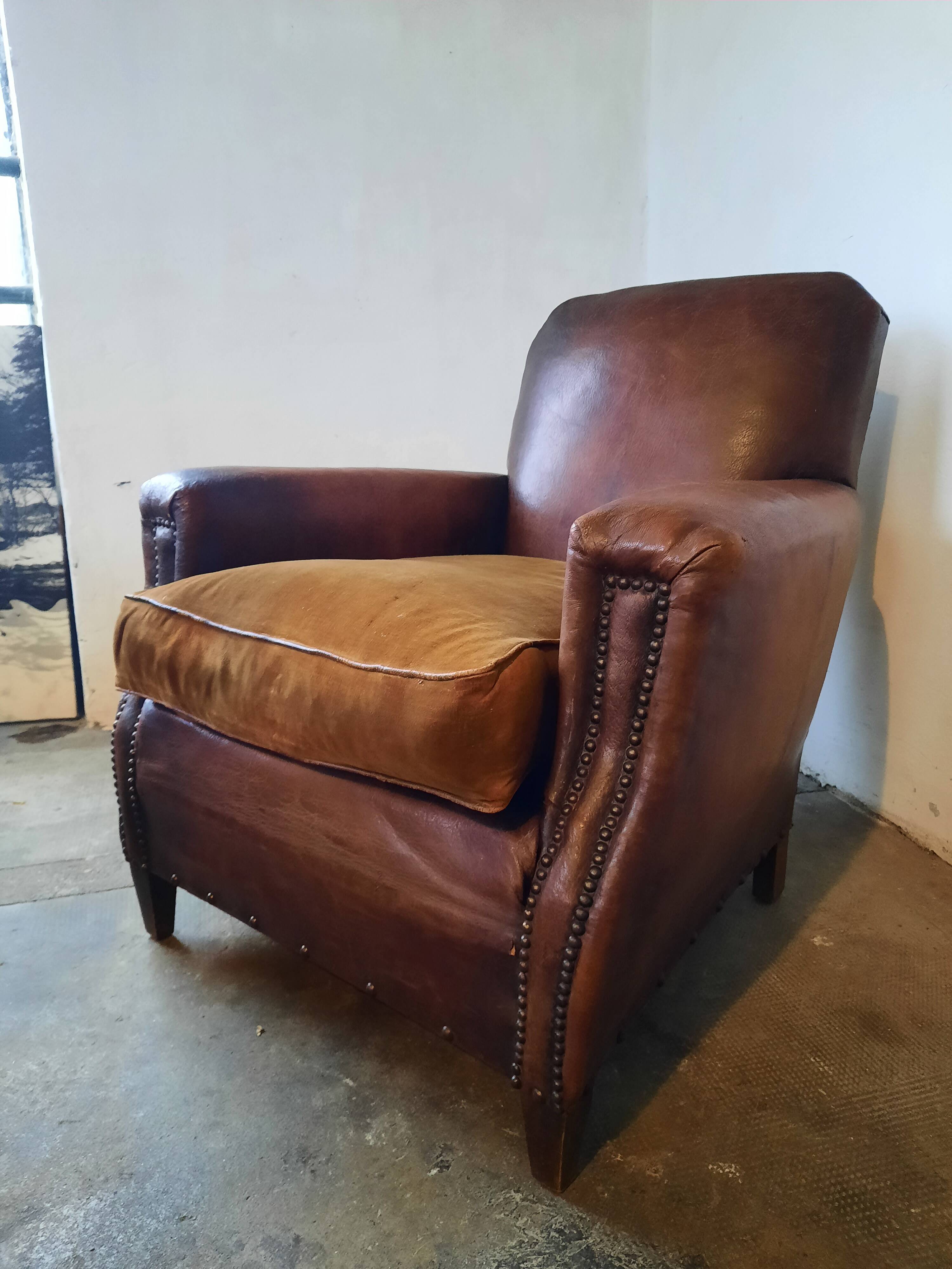 Old studded leather club chair 1930-1930