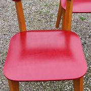 Set of 4 vintage chairs from the 50s in blond beech and red leatherette