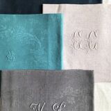 Set of four old damasked and monogrammed napkins, dyed in multiple colors