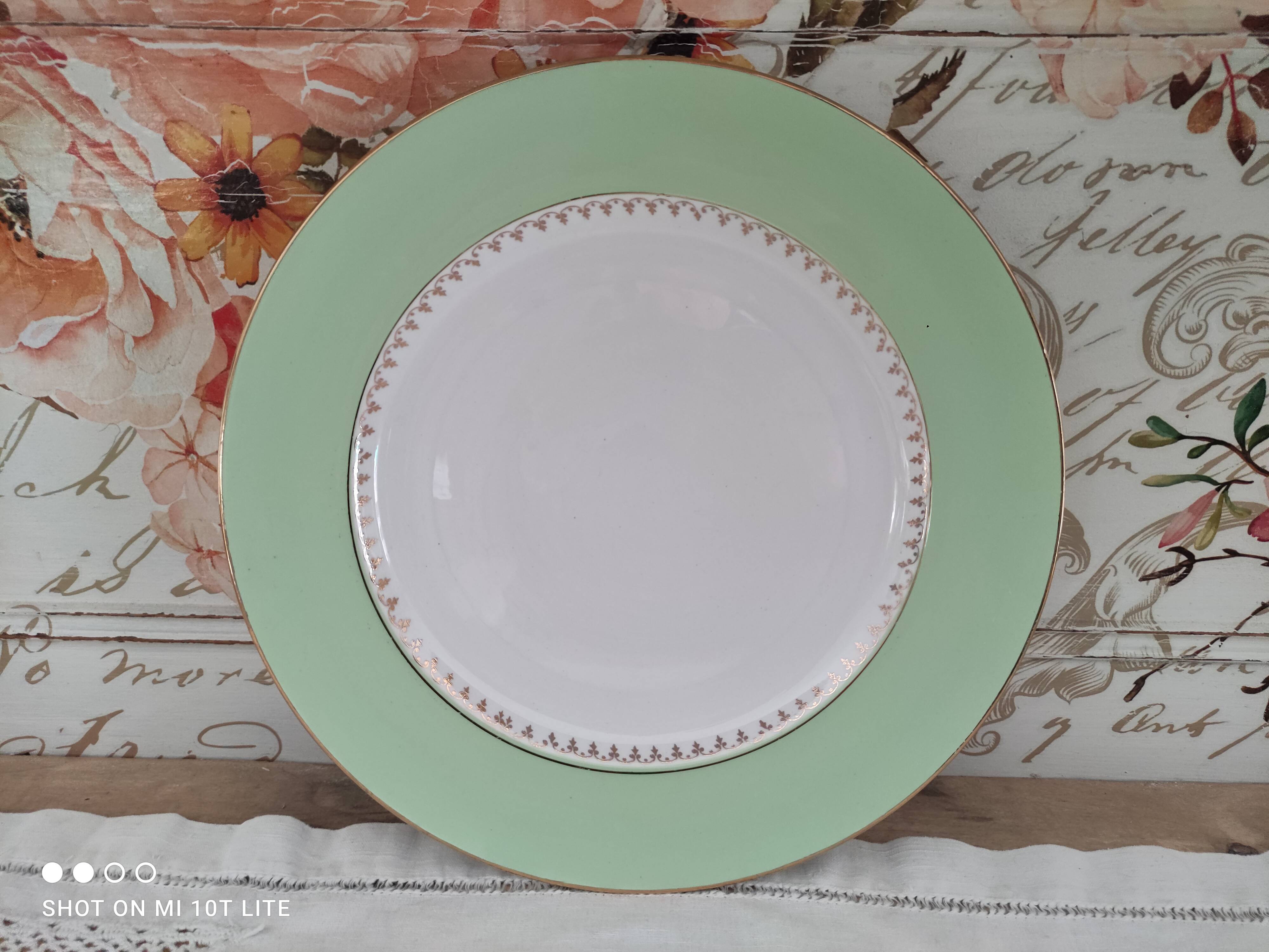 Round plate with aqua green rim and golden frieze, Cafés Lemaire.