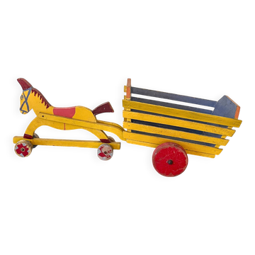 Horse-drawn cart and wooden cart, old pull toy.