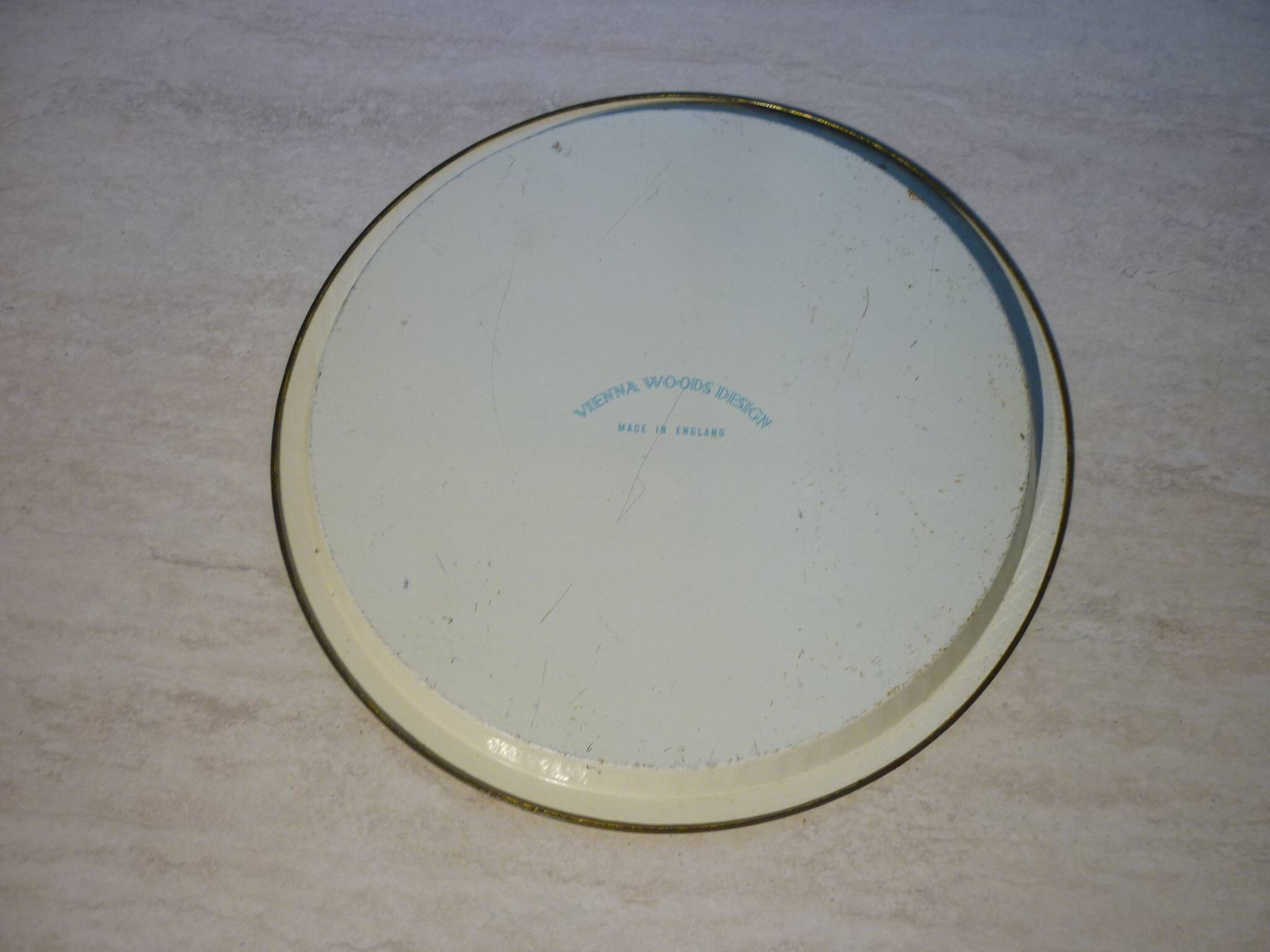 Blue cashmere round tray on white background.