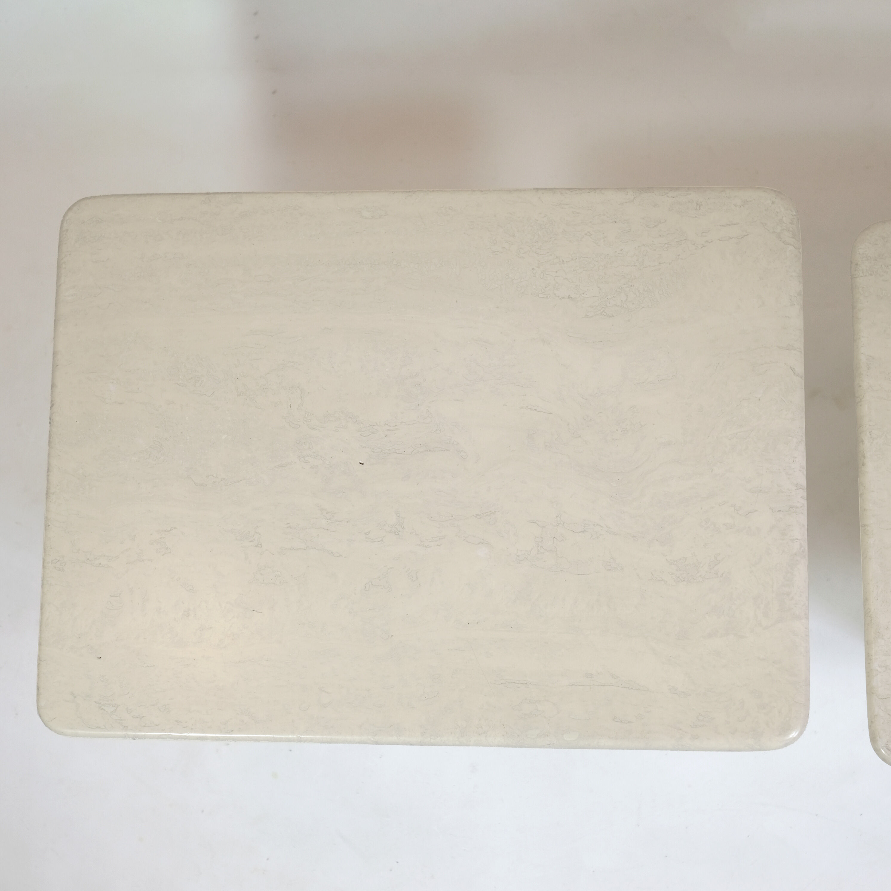 Pair of travertine trundle tables, Italy